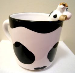 Swiss cup with cow on the edge