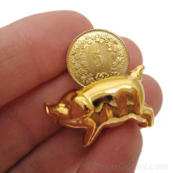 Small golden pig - Swiss 5 centime coin