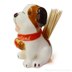 Saint Bernard dog holds toothpick
