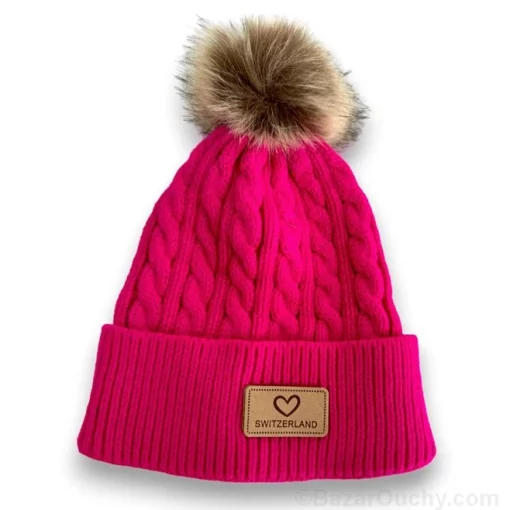 Bonnet rose avec pompon et inscription suisse